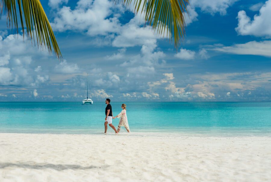 Journey Beyond Maldives coupe walking on the beach